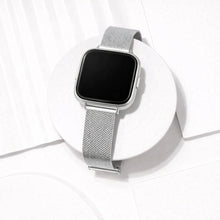 Silver Milanese mesh watch strap for Fitbit Versa 2 shown in a clean flat lay studio setting