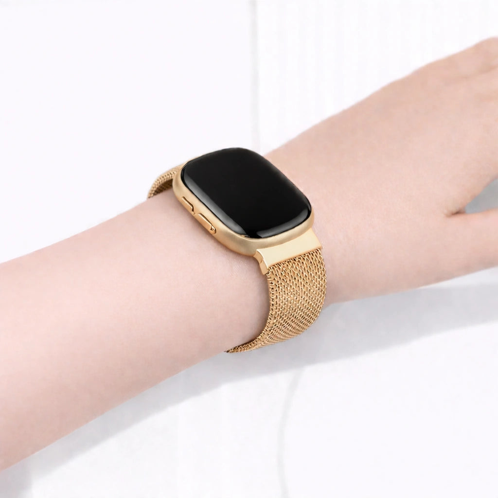 Fitbit Versa 3 gold metal band worn on wrist with breathable mesh design