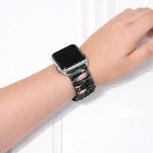 Flamingo print scrunchie Apple Watch strap worn on wrist with tropical bird pattern and elastic fabric