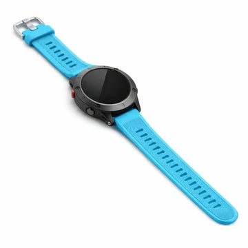 A light blue strap for the Garmin Epix attached to a black round watch, laid diagonally on a white background