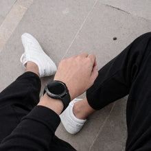 Black Garmin Fenix 6 band on wrist for everyday wear