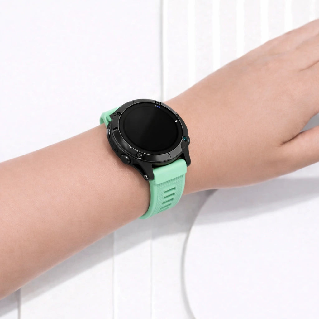 Mint Garmin Fenix 7 watch strap on wrist showing soft silicone and comfortable fit