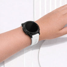 White Garmin Fenix 7 wristband on wrist with lightweight comfortable design