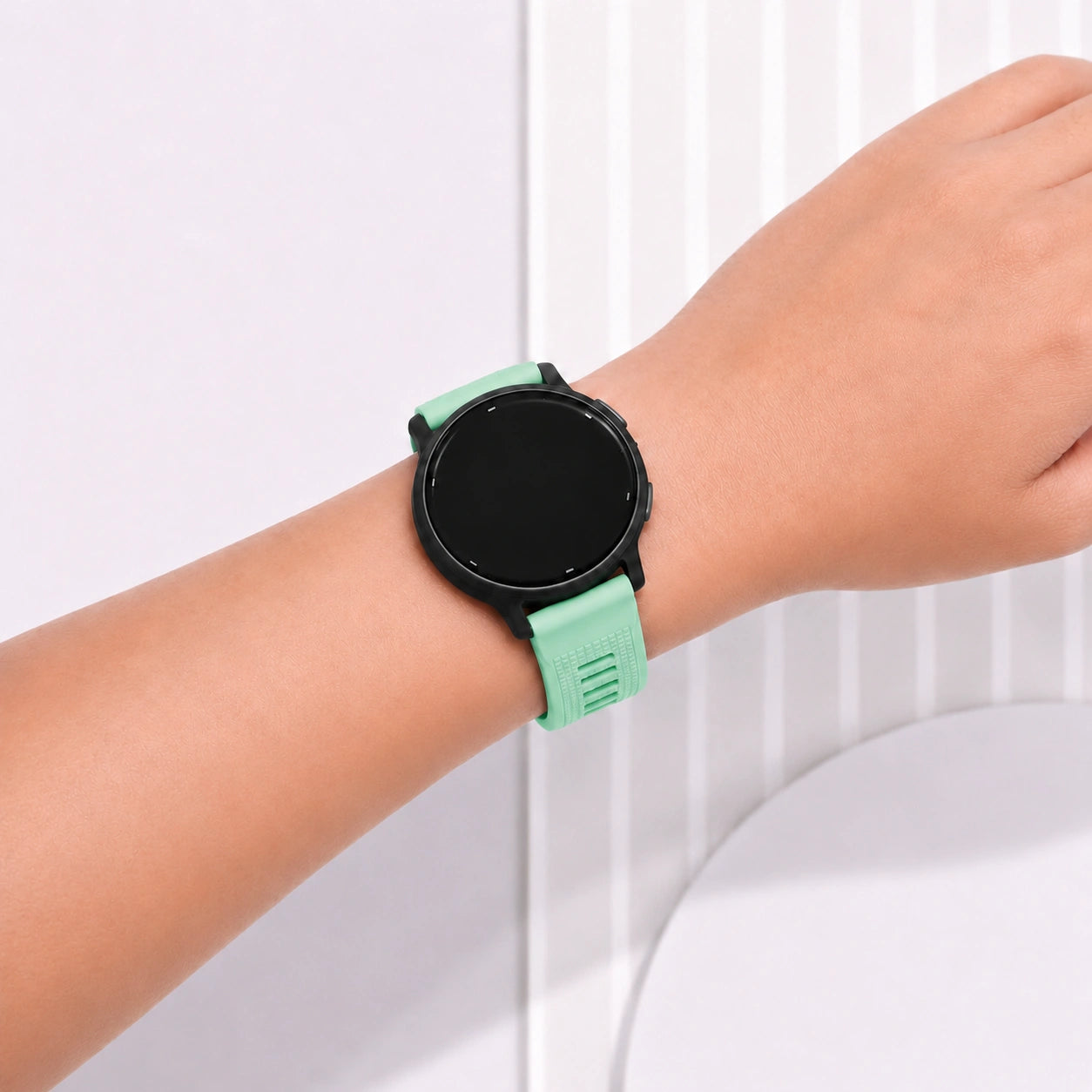 Mint silicone Garmin Forerunner 165 band fitted comfortably on the wrist.