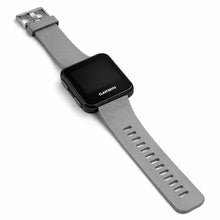 Grey watch strap compatible with Garmin Forerunner 35 shown on flat lay background