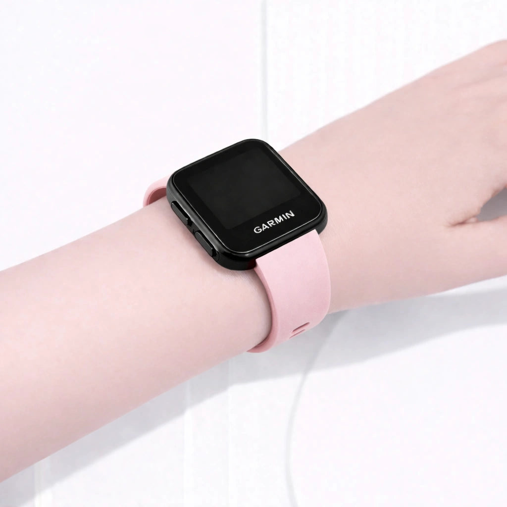 Light pink Garmin Forerunner 35 band worn on the wrist