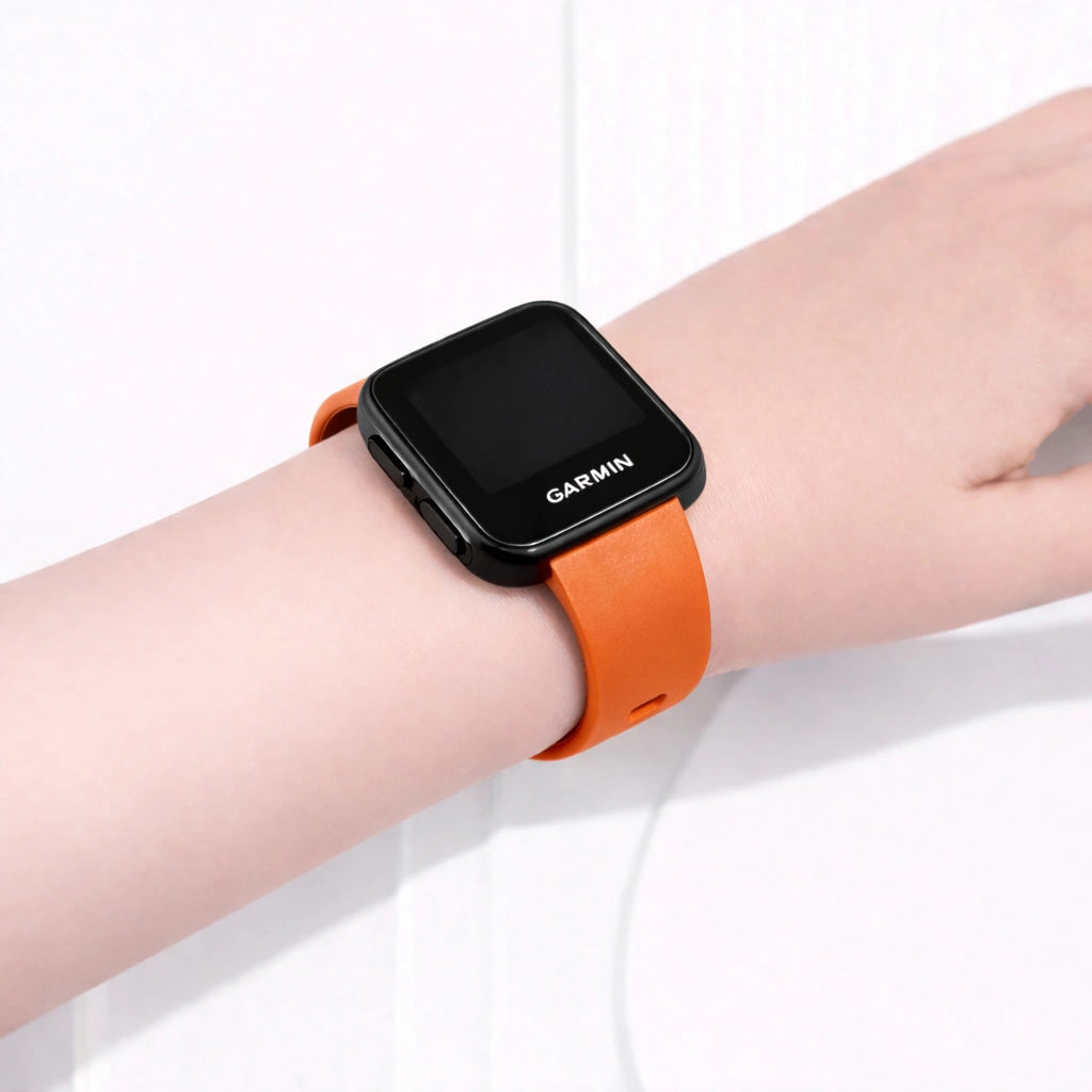 Garmin Forerunner 35 orange watch strap worn on the wrist with secure and comfortable fit
