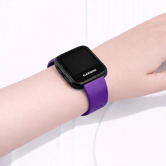 Purple Garmin Forerunner 35 watch band worn on the wrist with a secure, comfortable fit