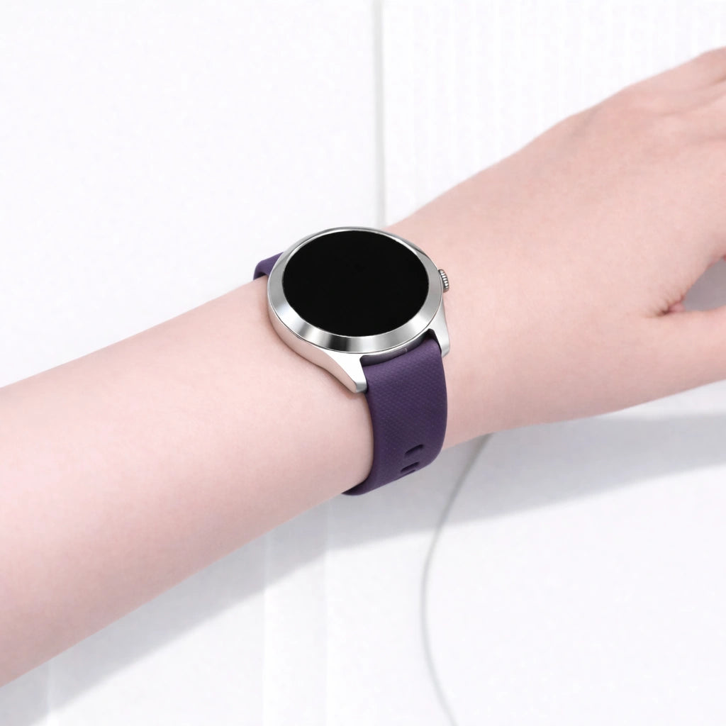 Garmin Vivoactive 4S smartwatch worn on the wrist with a purple silicone watch strap and silver case