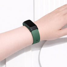 Green silicone band for Fitbit Charge 6 worn on the wrist