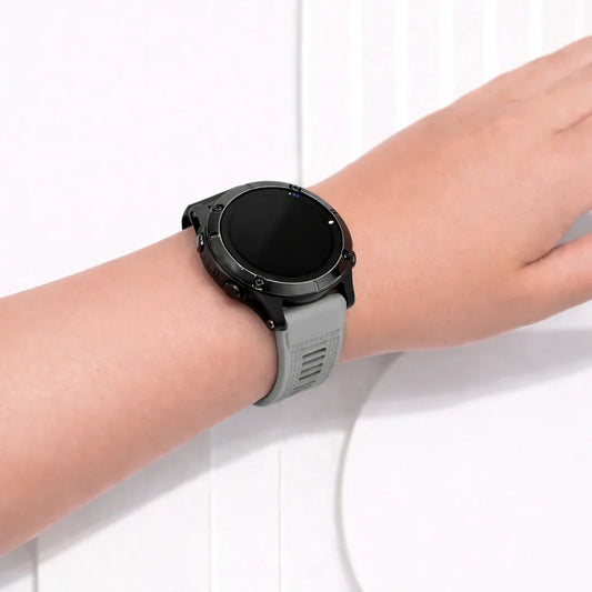 Grey Garmin Epix Gen 2 silicone watch strap worn on the wrist for an understated everyday look.