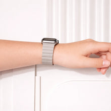 Grey leather 2 Part Apple Watch wristband worn on the wrist.