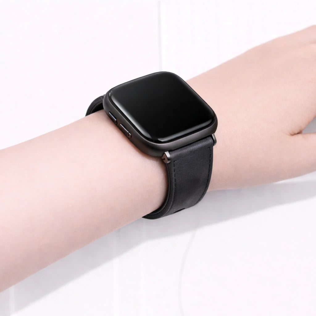 Grey leather wristband for Fitbit Versa 2 worn on the wrist with a comfortable, adjustable fit