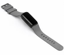 Grey silicone strap for Fitbit Inspire 3 laid flat