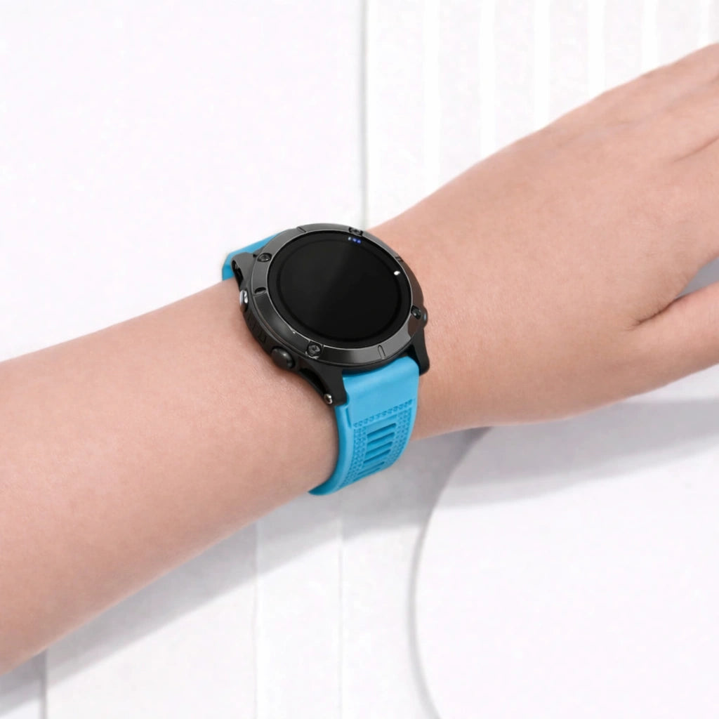 Light blue Garmin Fenix 7 watch strap on wrist showing soft silicone and snug fit
