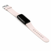 Light pink Fitbit Luxe band fitted to tracker with silver buckle and matte finish