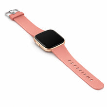 Light pink silicone watch strap for Fitbit Versa 2 shown in a clean flat lay view