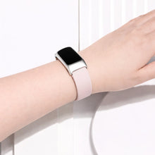 Light pink watch strap for Fitbit Charge 6 worn on the wrist