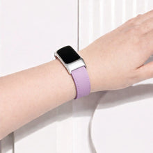 Light purple Fitbit Charge 6 strap worn on the wrist