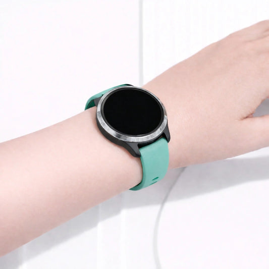 Garmin Venu smartwatch worn with a mint silicone sport band