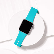 Mint silicone Apple Watch strap displayed on clean white background