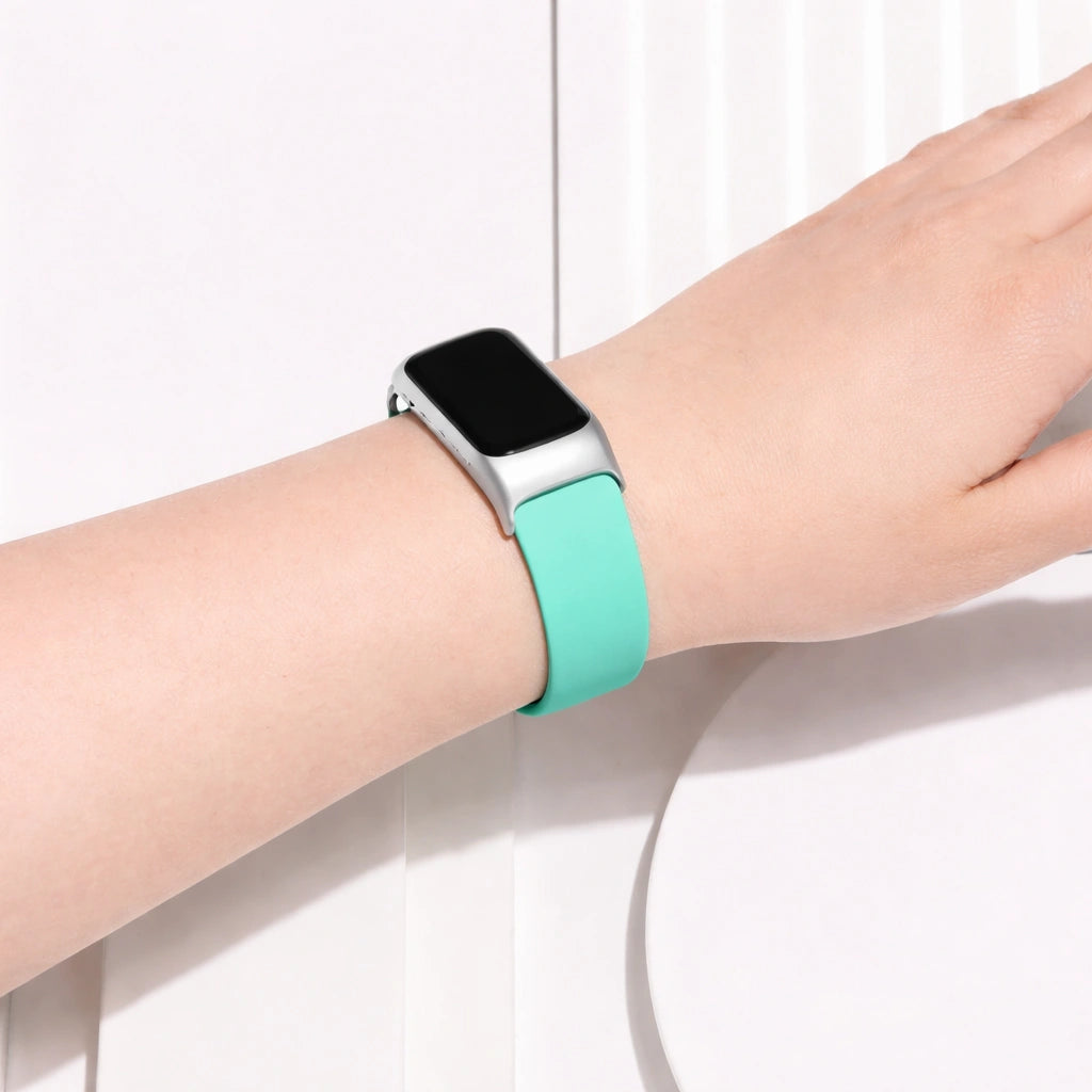 Mint watch strap for Fitbit Charge 6 worn on the wrist