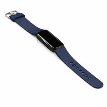 Navy blue Fitbit Luxe watch band fitted to tracker with silver buckle