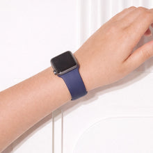 Navy silicone Apple Watch band worn on wrist with soft flexible fit
