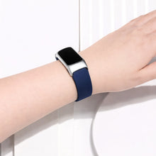 Navy watch strap for Fitbit Charge 6 worn on the wrist