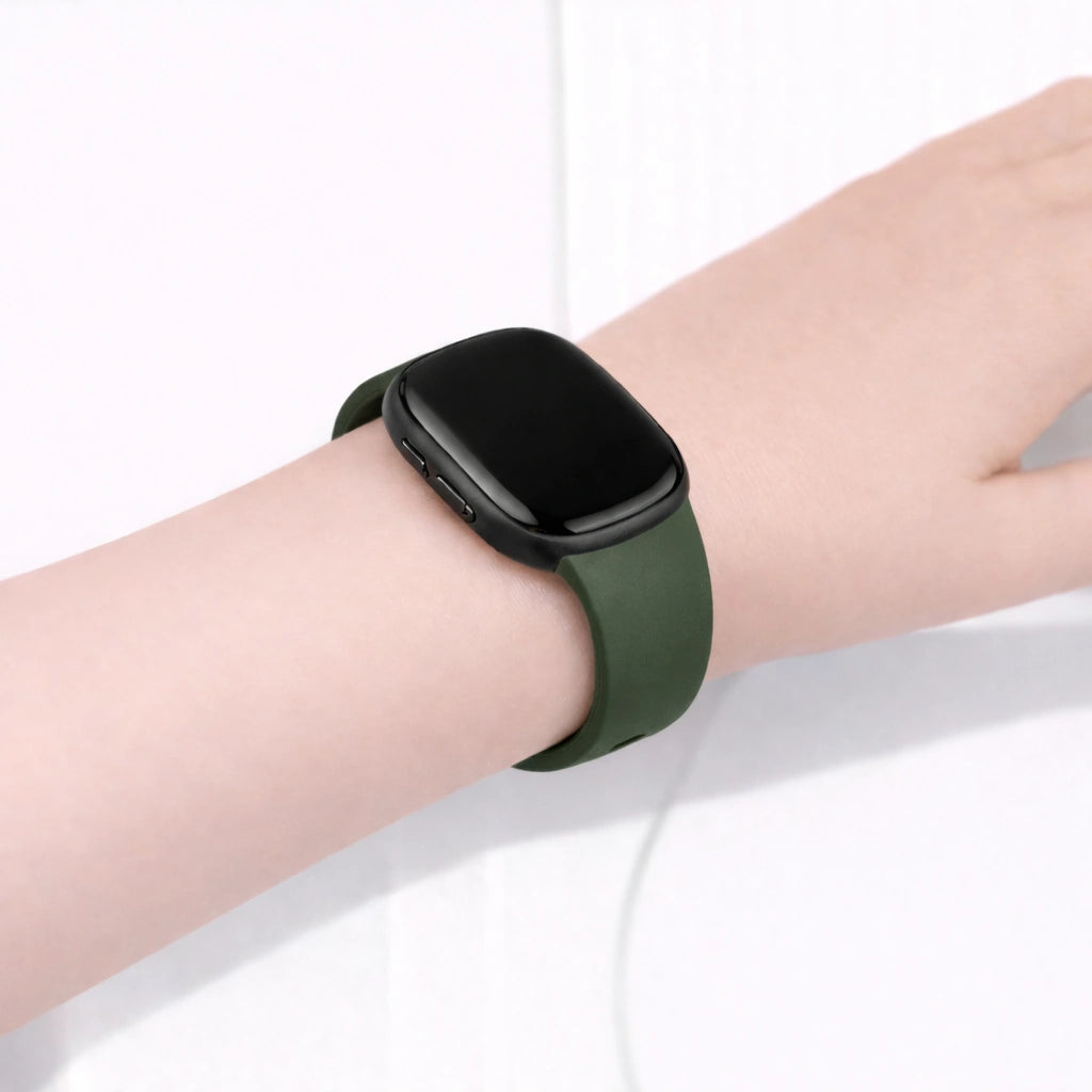 Pine green watch band for Fitbit Versa 4 shown on user's wrist