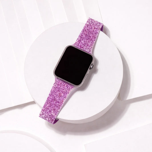Purple sparkly Apple Watch band displayed in a minimal flat lay with shimmering finish