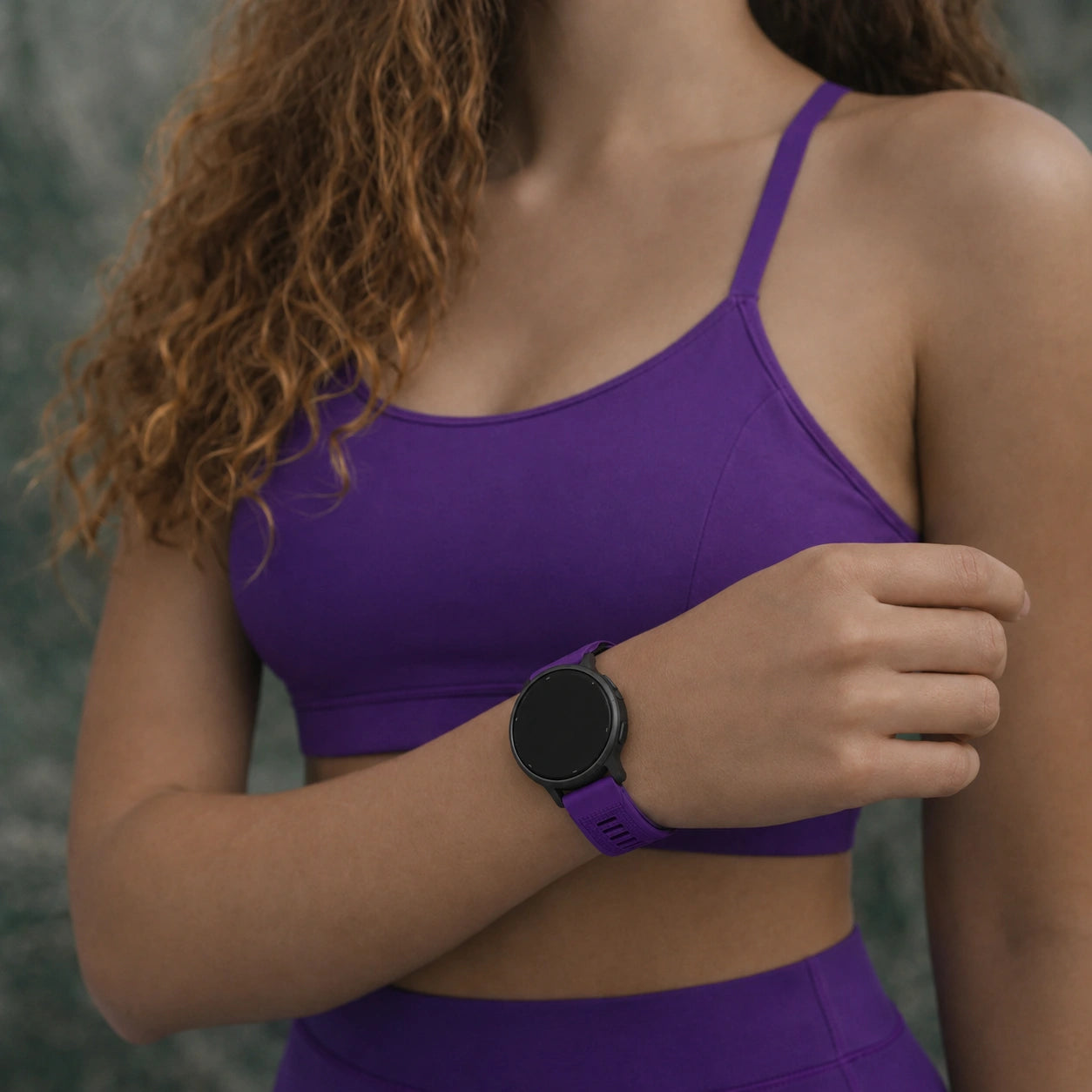 Dark purple Garmin Venu 3S strap worn during a workout session.