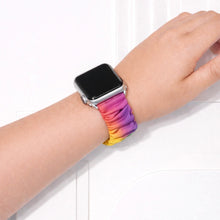 Rainbow scrunchie Apple Watch wristband worn on wrist with soft multicolour gradient fabric