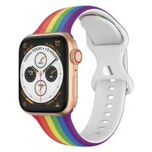 Front view of Apple Watch with vibrant rainbow strap and secure white buckle