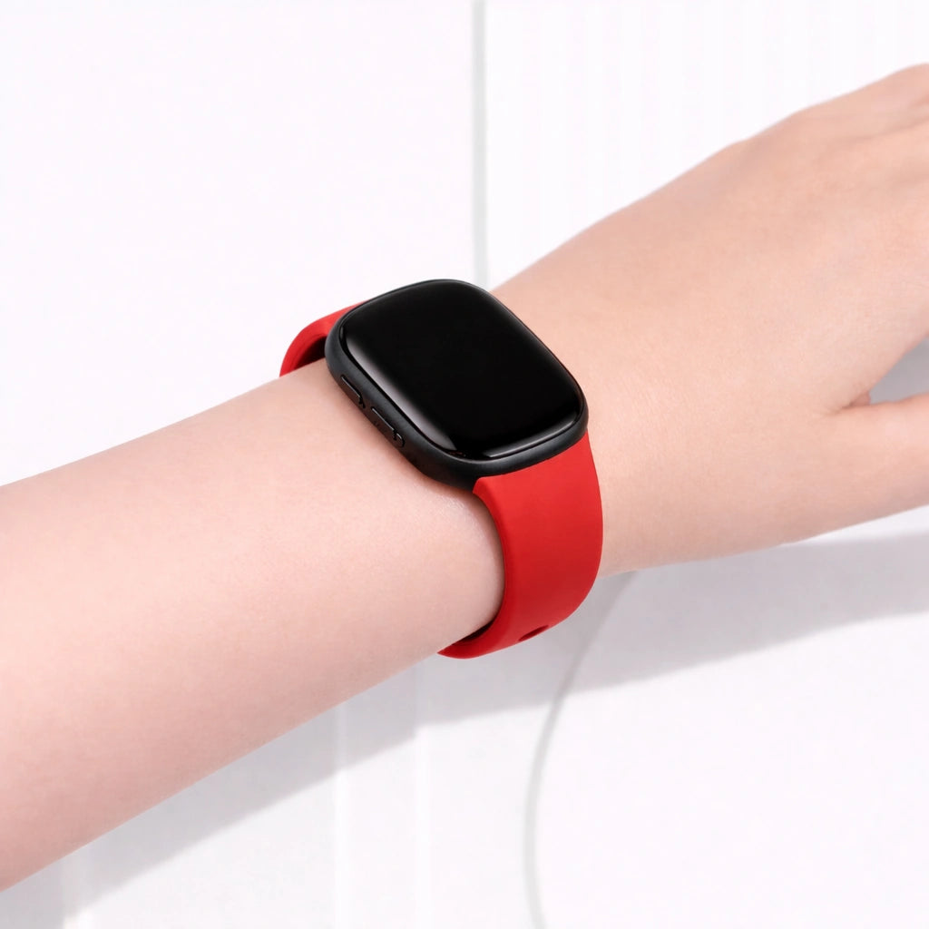 Red wristband worn on the wrist, compatible with Fitbit Versa 4