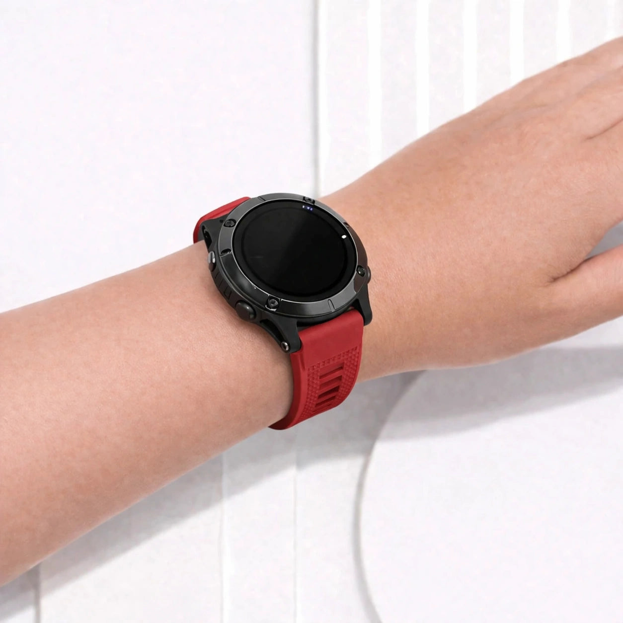 Red strap for Garmin Fenix 7 with soft silicone feel and snug adjustable fit