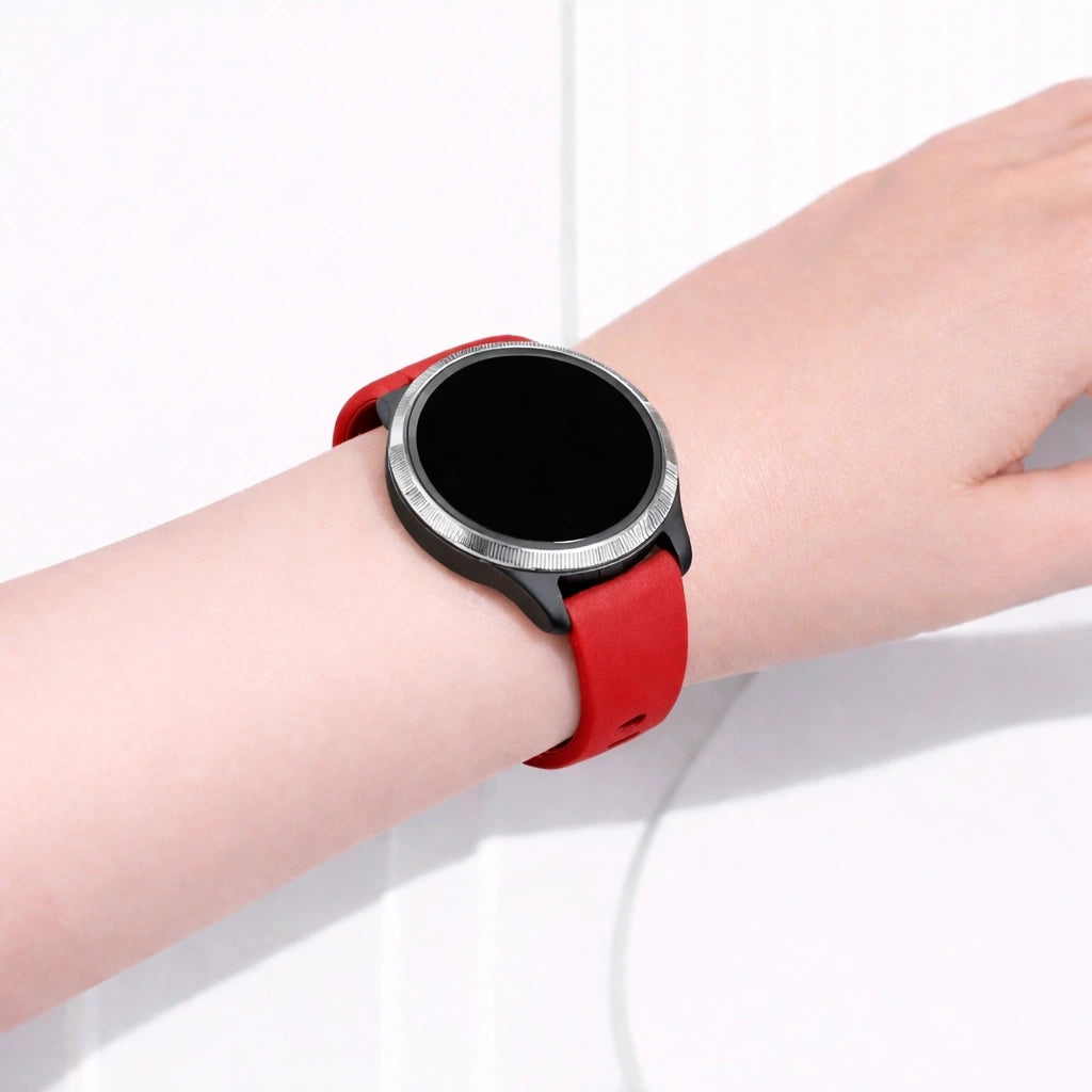 Garmin Venu smartwatch worn with a red silicone sport band