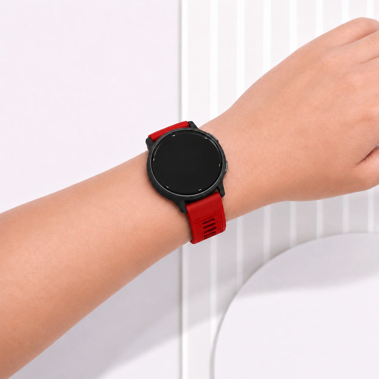 Red Garmin Vivoactive 5 watch band being worn as an everyday accessory
