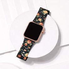 Apple Watch strap with red rose floral pattern displayed on a white platform background.