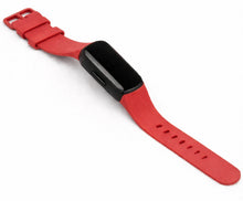 Red silicone strap for Fitbit Inspire 3 shown in a flat lay