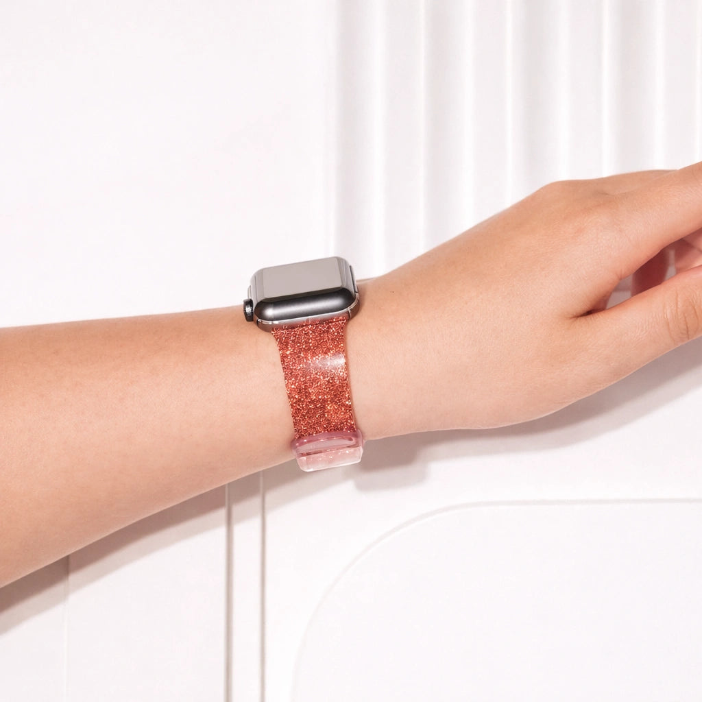 Red sparkly Apple Watch wristband worn on wrist with bold shimmering finish