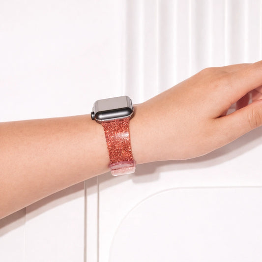 Red sparkly Apple Watch wristband worn on wrist with bold shimmering finish