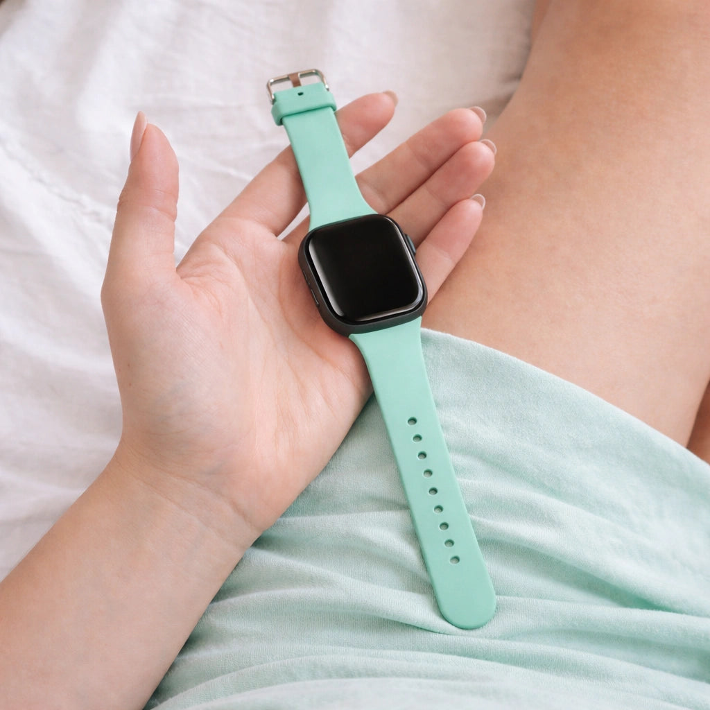 Teal Fitbit Versa 3 band held in hand, soft silicone replacement strap for everyday comfort