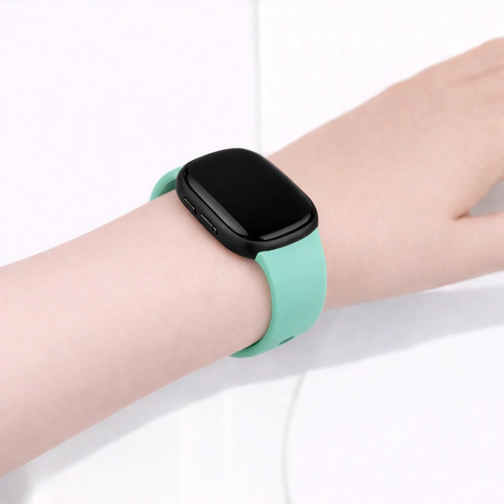 Teal band worn on the wrist, designed for Fitbit Versa 4