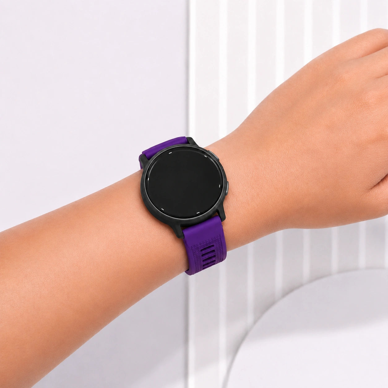 Dark purple Garmin Venu 3S strap fitted to a smartwatch and worn on the wrist.