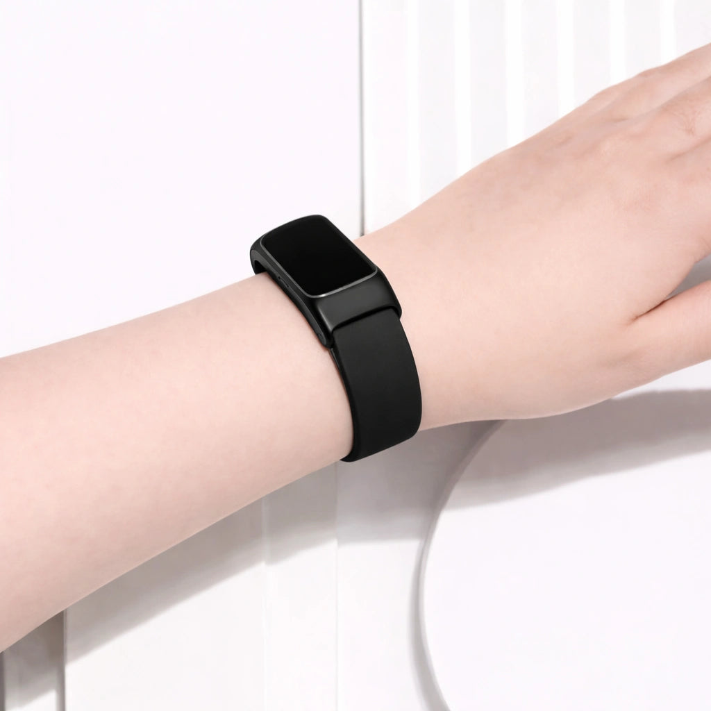 Watch strap for Fitbit Charge 6 worn on the wrist with a black silicone finish