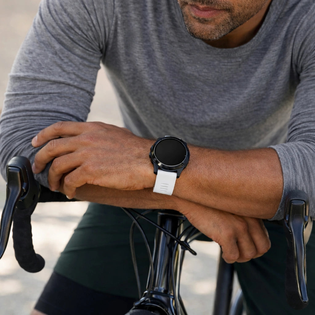 White sports watch strap for Garmin Forerunner 965 worn during cycling for active performance