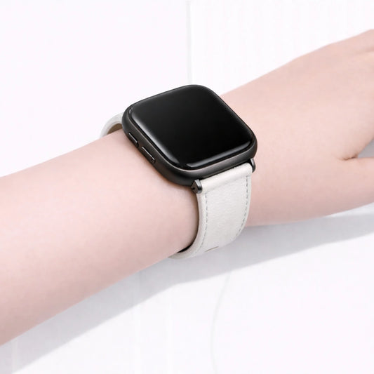 White leather Fitbit Versa 2 wristband worn on the wrist with a slim, comfortable fit.