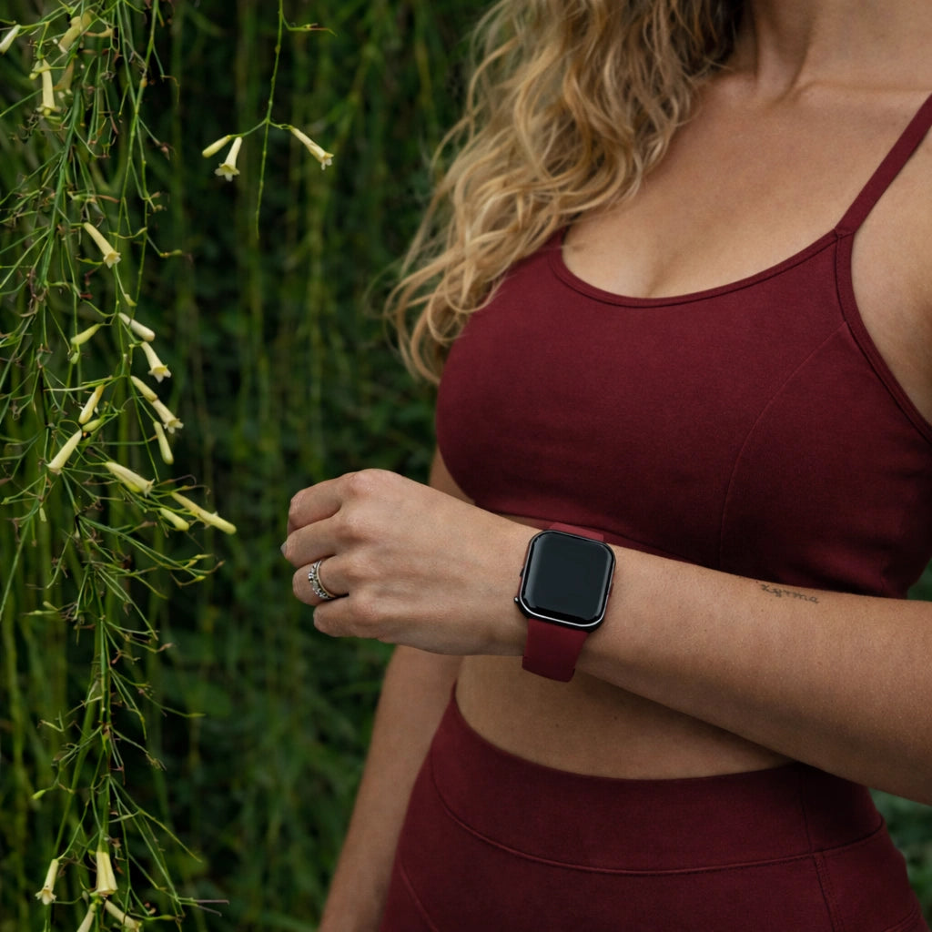 Wine red Fitbit Versa 3 watch strap worn during outdoor exercise