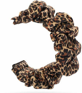 Trendy Fitbit Versa 2 scrunchie strap in leopard print, designed for a secure fit with no buckles or clasps